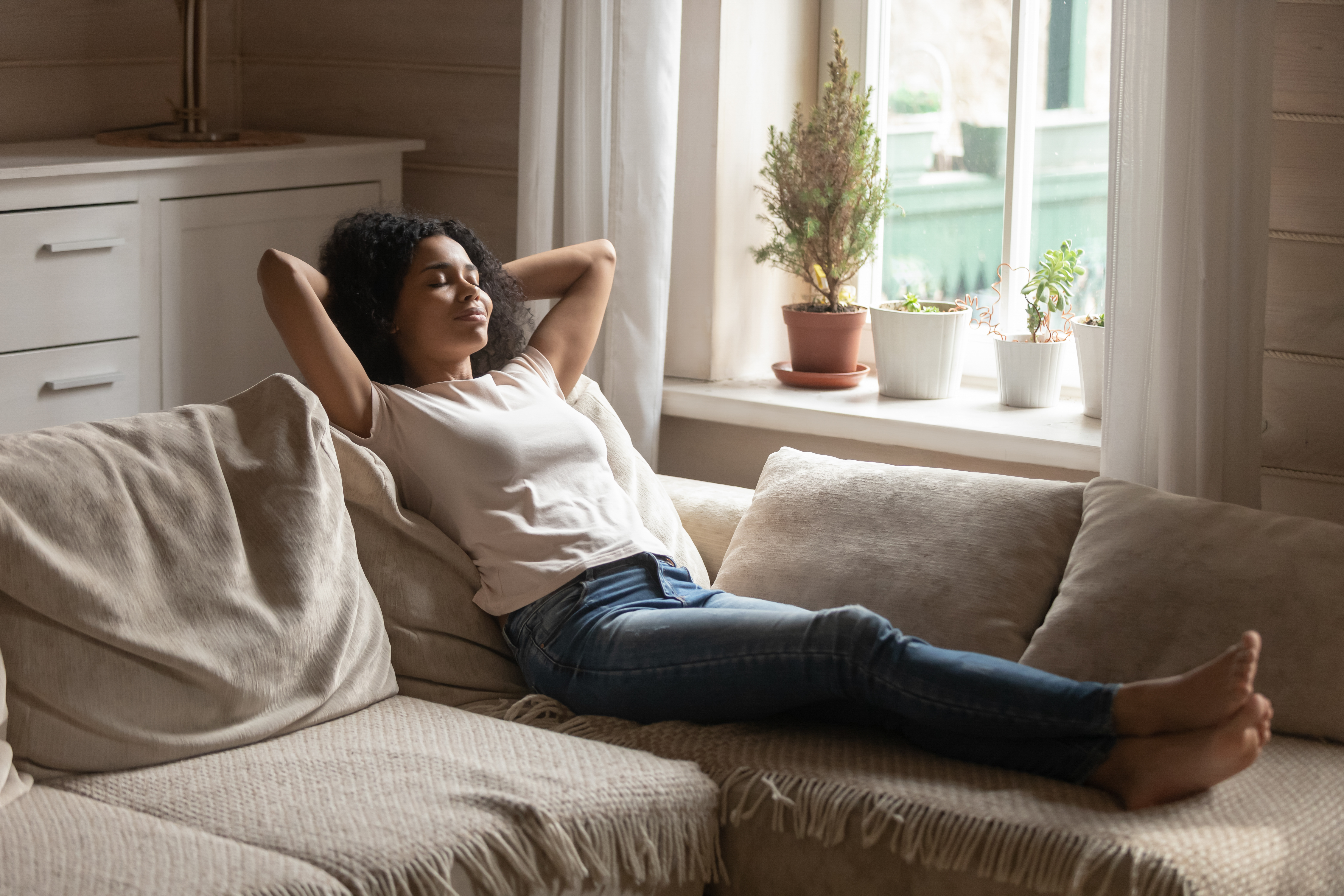 Homeowner relaxing on couch